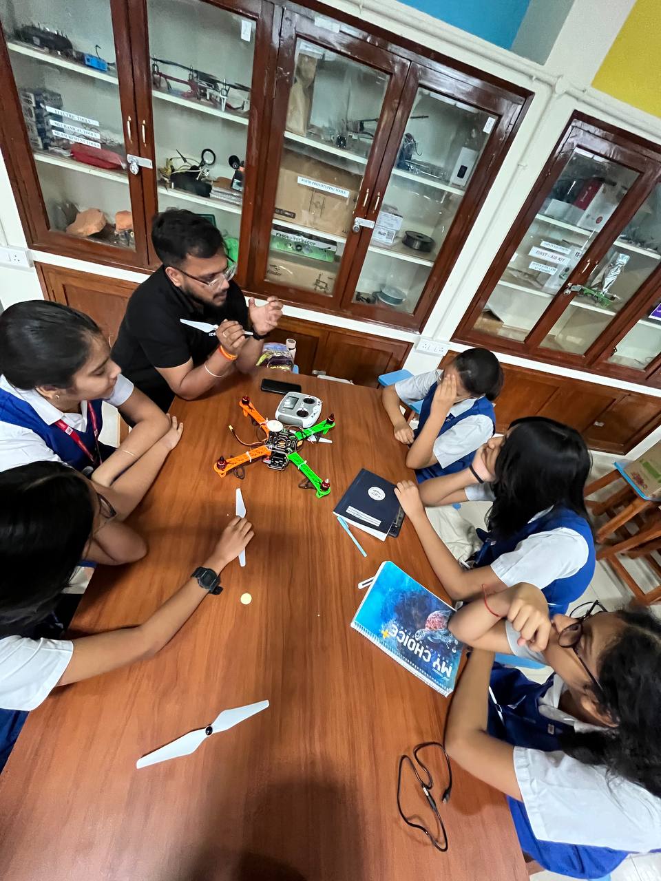 Students assembling drone components during an INNVERSE hands-on workshop